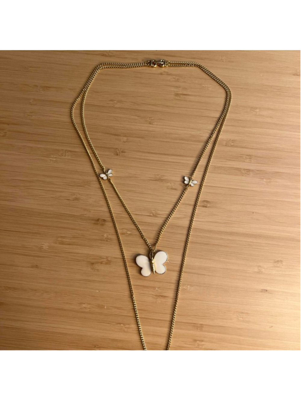 Vintage double layered gold necklace with white butterfly charms